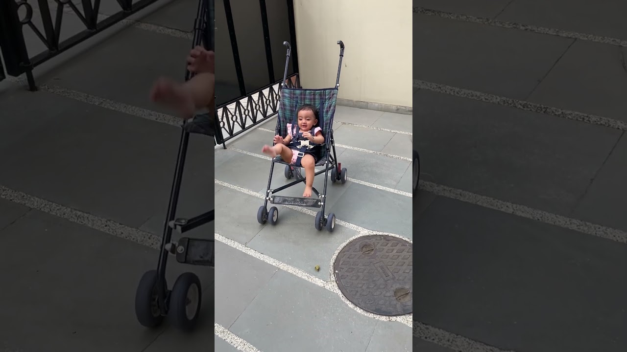 baby trying hard to get out of pram😆