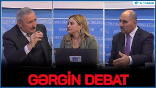 : GRGIN DEBAT: Rusiya il 10 ayliq QARSIDURMA nec bitmlidir? - Iki ekspert arasinda QIZGIN POLEMIKA