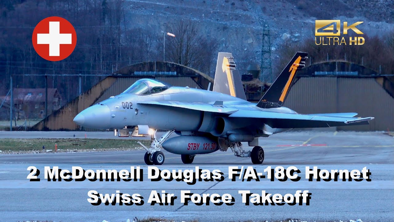 2 McDonnell Douglas F-18 Hornet Swiss Air Force J-5003 J-5002 departure at Meiringen Air Base LSMM