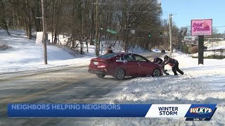 Neighbors helping each other out after snow storm in Louisville