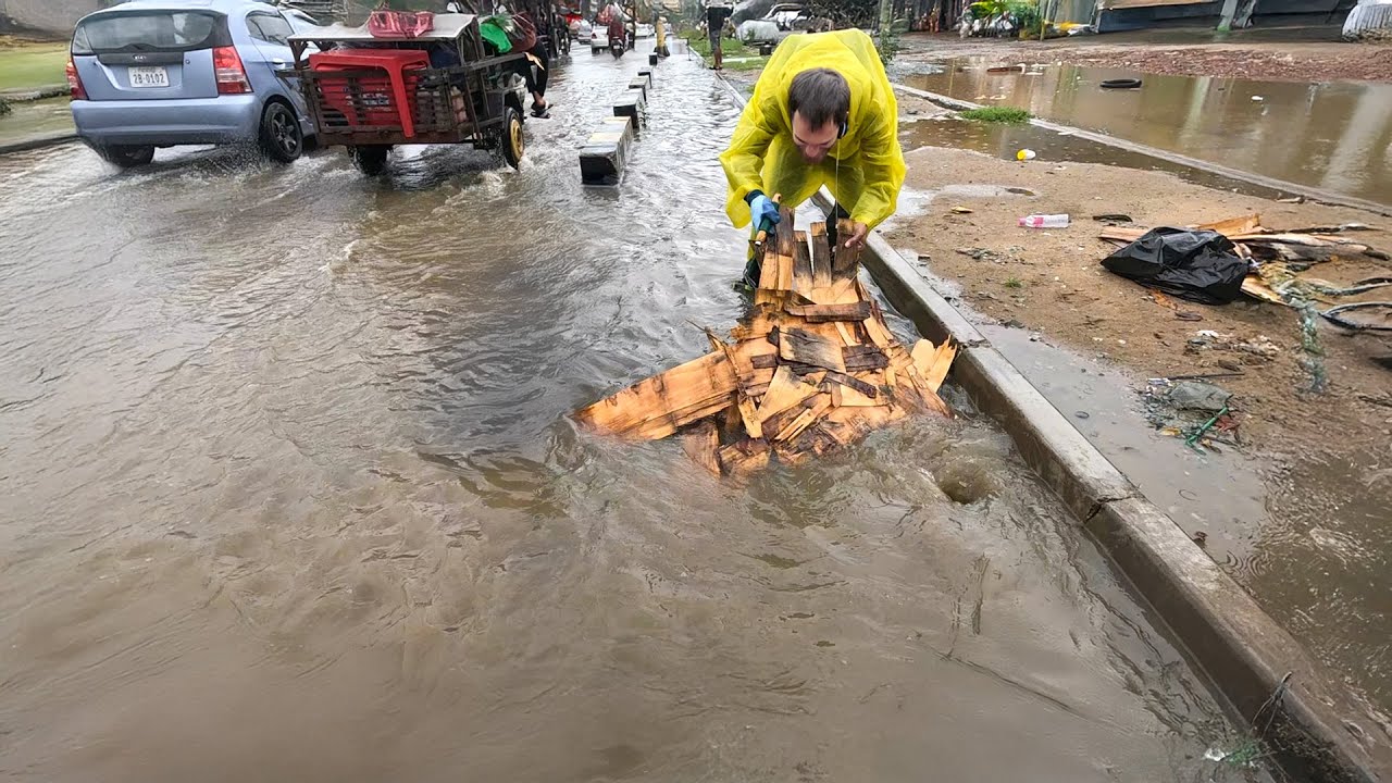 Street Saved by Extreme Flood Drain Clearing Effort - YouTube