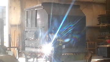 Dumpster repair - welding new floor into 8 yard