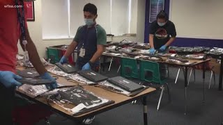 Dallas ISD staff preparing technology kits for elementary students