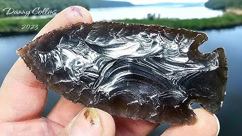 Flintknapping  a Thin Slab Of Rainbow Obsidian With Indirect Percussion.