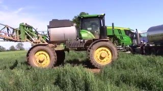 John Deere R4045 Sprayer pulls a Mack MaxiCruise Truck out of the Mud