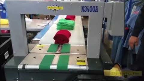 Dynaric N3400A High-Speed Strapper Securing Bundles of Rags | ProPac.com