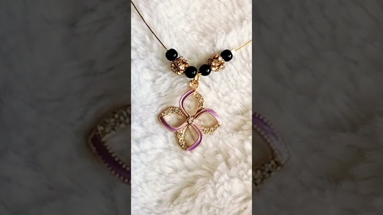Black beads invisible chain with purple colour flower pendant
