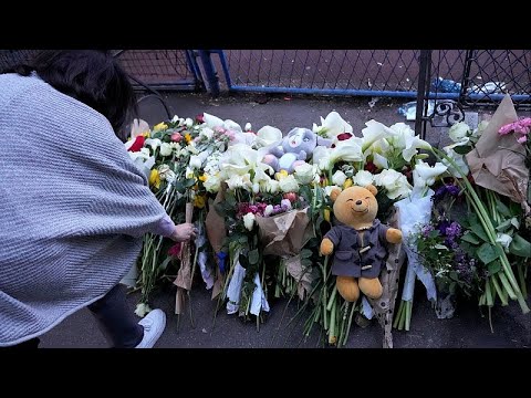 In pictures: mourners leave flowers after eight children and a guard were shot in a Belgrade school