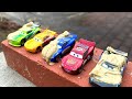 13 disney cars tomica and jumping into the mud pool