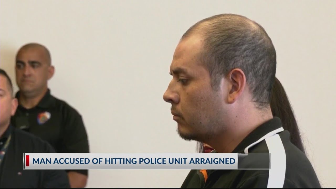 Man accused of hitting police car arraigned - YouTube