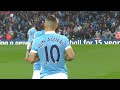 Fabian Delph helping Sergio Aguero with his buttons