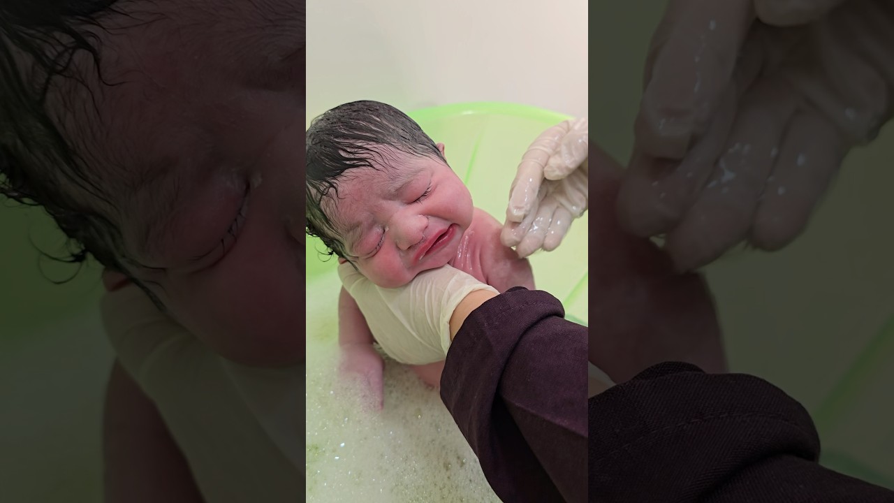 Cute baby first bath