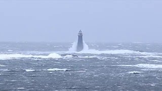 Wave crashing over Minots Ledge Light