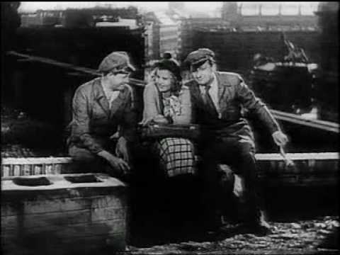 Scene from the 1932's film âEin Blonder Traum (âA Blonde's Dream" / âReve blonde" / âSogno Biondo") starring Willy Fritsch, Lilian Harvey and Willi Forst. While the actors are sitting on the roof of the old Marstall in the middle of Berlin you get some impressions on how Berlin looked like before the whole area was destroyed later on. For example you can see the top of the famous castle which was destroyed by the communist regime even after WW2. The film was a huge success at that time. When it premiered September 1932 in Berlin, police had to close the roads to the film theatre because thousands of people wanted to see the actors arriving. The two songs performed, "Irgendwo auf der Welt" and "Wir zahlen keine Miete mehr", have been written by Werner Richard Heymann. The film was directed by Paul Martin.