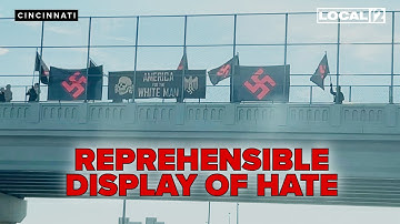 Protestors with Nazi flags confronted by angry crowd