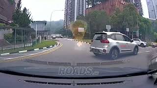 A car with plate SHB8728B entered the roundabout without checking properly.