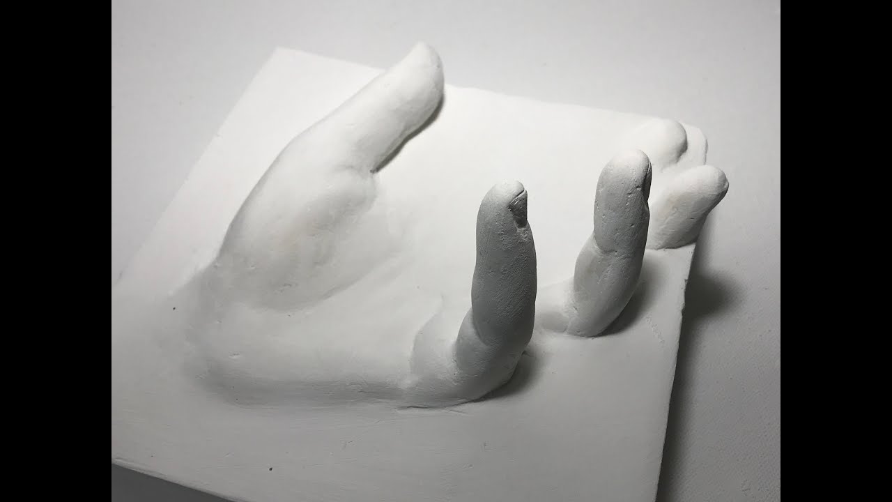 Male Hand, Wrapped In A Plaster Cast, Scrolls Through A