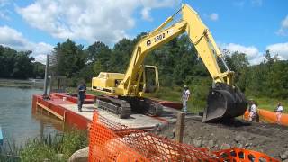 Excavator loaded onto Barge