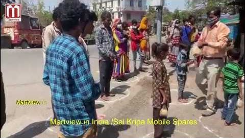 Martview India Teams / Sai Kripa Mobile Spares - Food Distribute To The Poor in front of retail shop