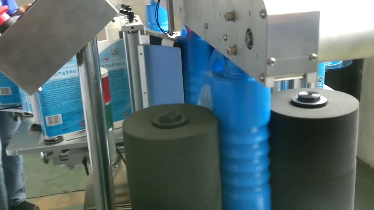 laundry bottle double side labeling machine - YouTube