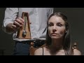 A woman hears a metronome and becomes hypnotized, striking a pose like a statue.#hypno