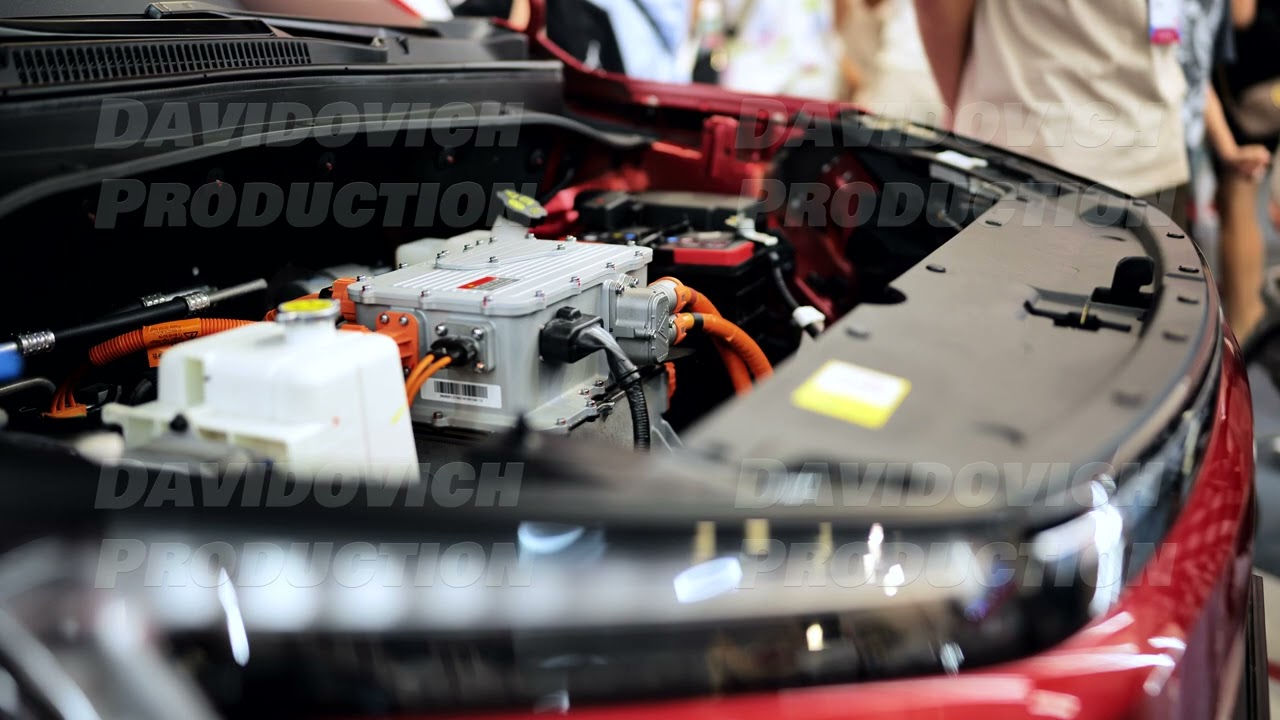 Electric vehicle engine with power inverter system at a car technology exhibition