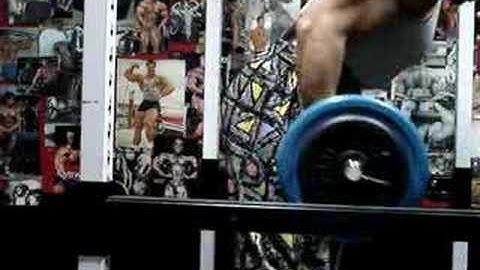 Michael Gundill performs Biceps curls (set 6) with elastic bands