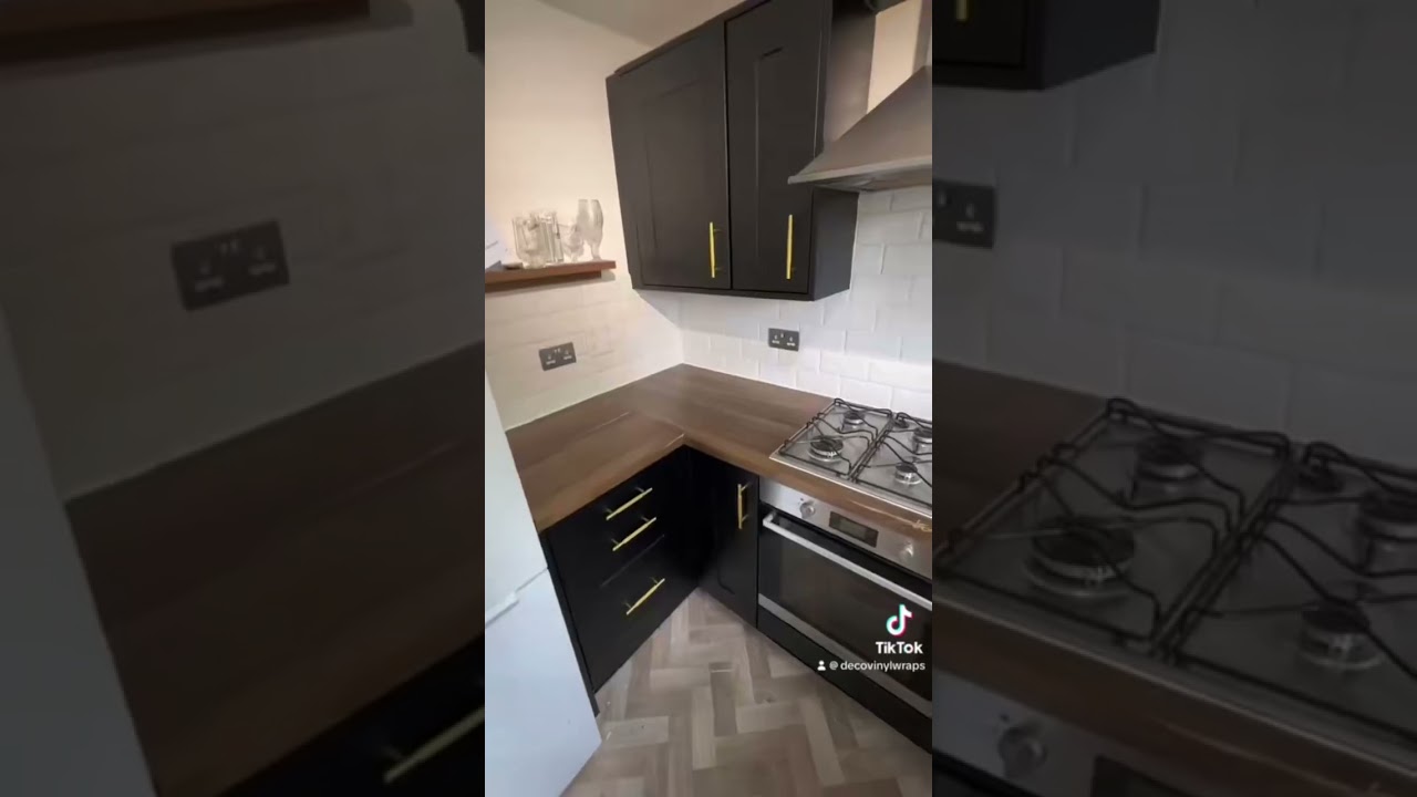 Kitchen vinyl wrap! Wrapped in matte black with flagstaff oak on the worktops 