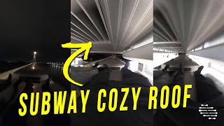Two People Laying Flat on Top of the Subway as It Travels