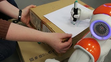 Nao paints christmas tree