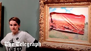 Climate protester sticks poster to Monet painting