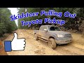 Skidsteer Pulling Out Toyota Pickup