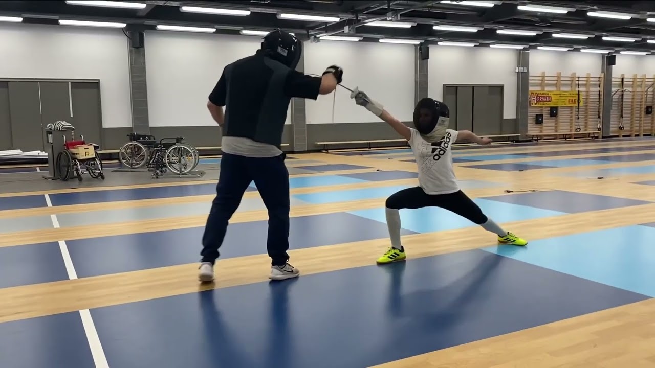 Fencing foil lesson with young fencers