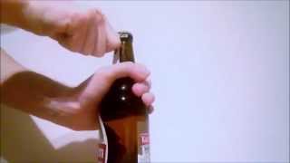 Open a beer bottle with key