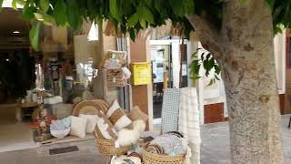 Afternoon on the main street of Arta, Mallorca. Restaurants and dress shops - a paradise for women