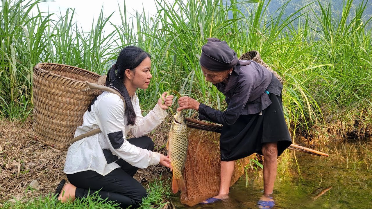 homeless girl surprised to see poor old woman catch a big fish