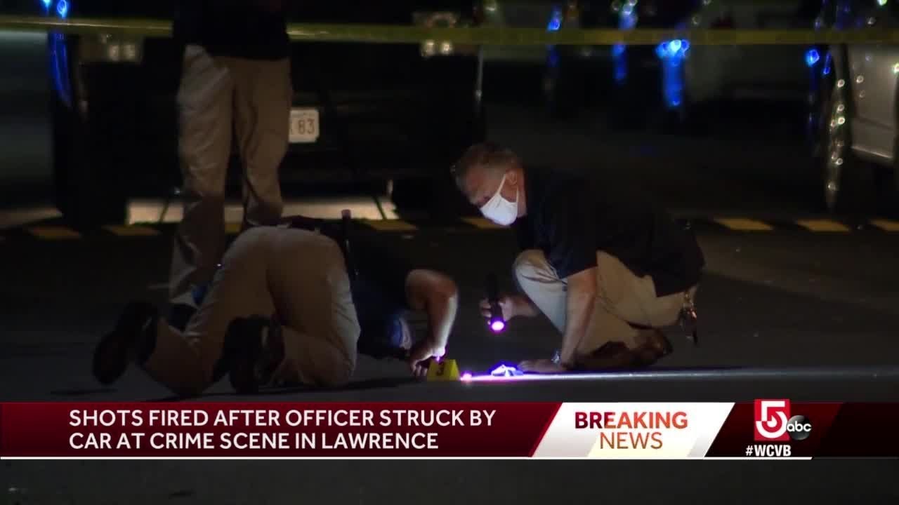 Shots fired after officer struck by car in Lawrence - YouTube