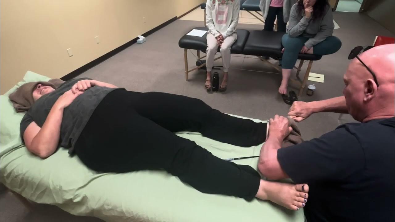 Deep tissue foot massage using tools and hands. Raynor massage therapy