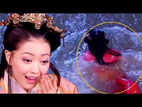 The scheming woman deliberately pushes Cinderella into the water,but the prince jumps in to save her
