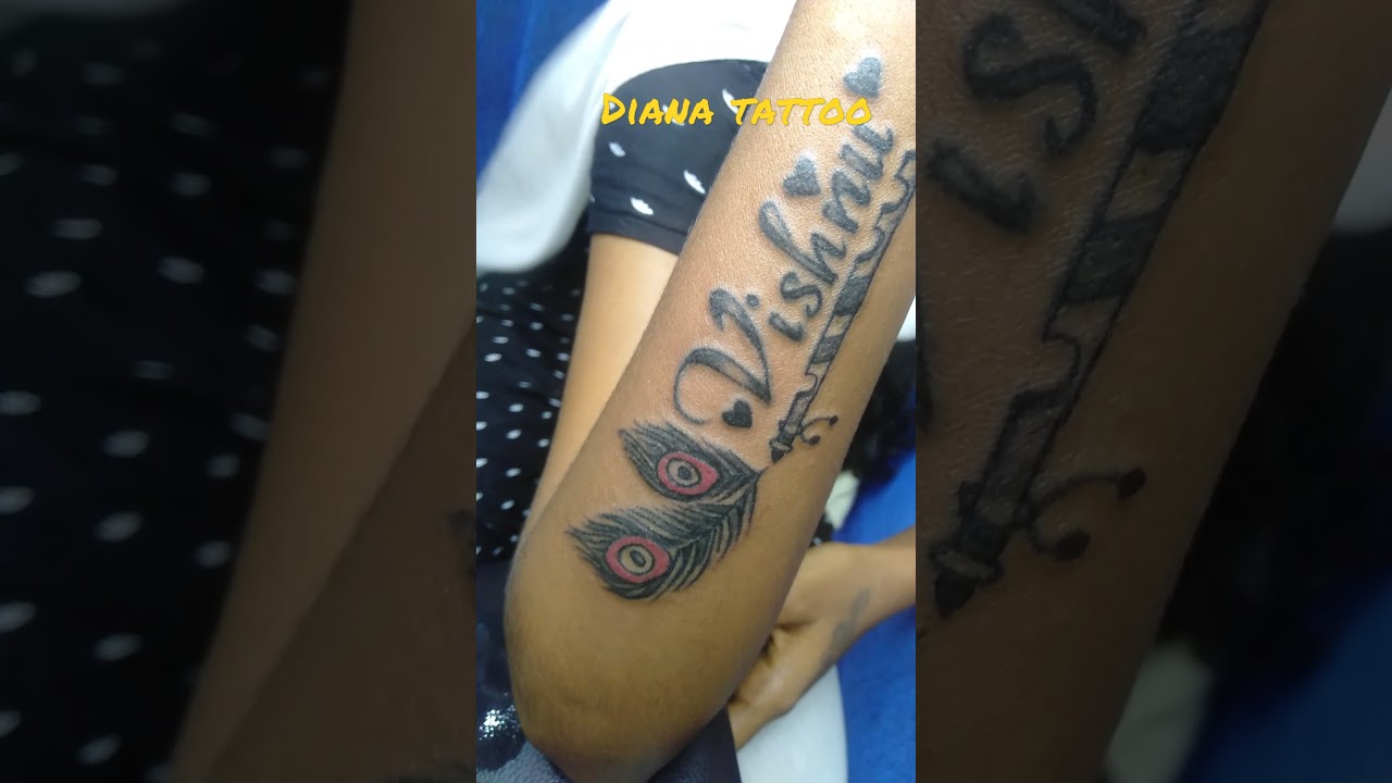 peacock feather tattoo , Krishna  flute tattoo , name tattoo