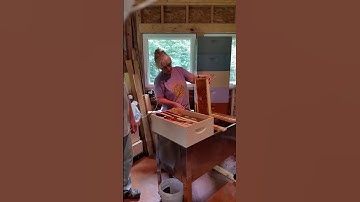 Vicki uncapping honey supers