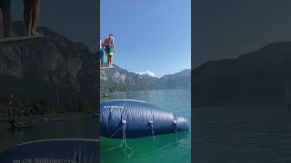 Two Kids Jumping Onto a Water Blob Causing Another to Bounce Off