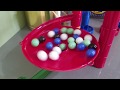 Overflowing another marble run with marbles