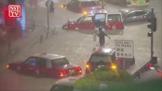 Hong Kong's heaviest rain in 140 years floods city streets, metro