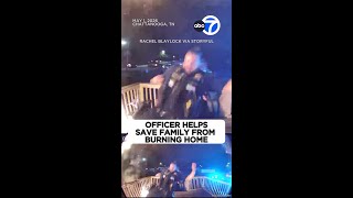 Officer helps save family from burning home