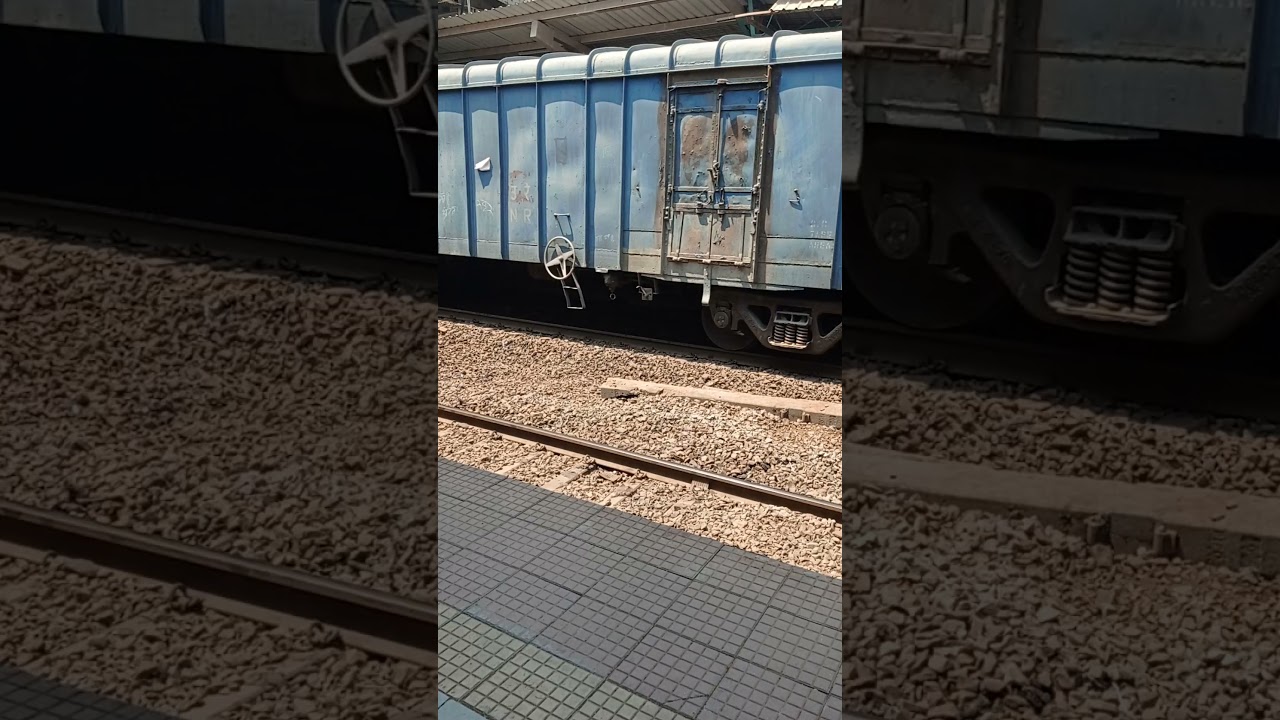 OLD WAG - 5 Twins with freight train.  