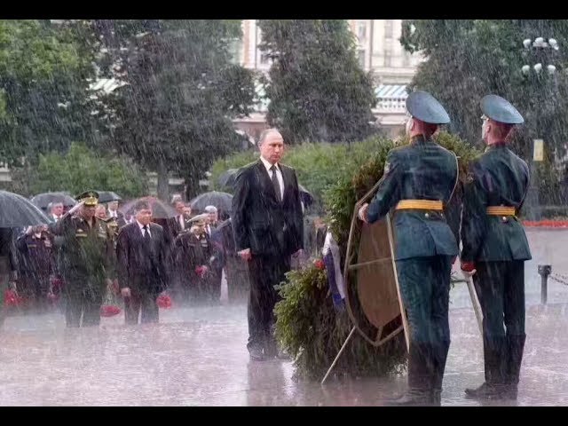 Putin braves rain to honor WWII victims class=