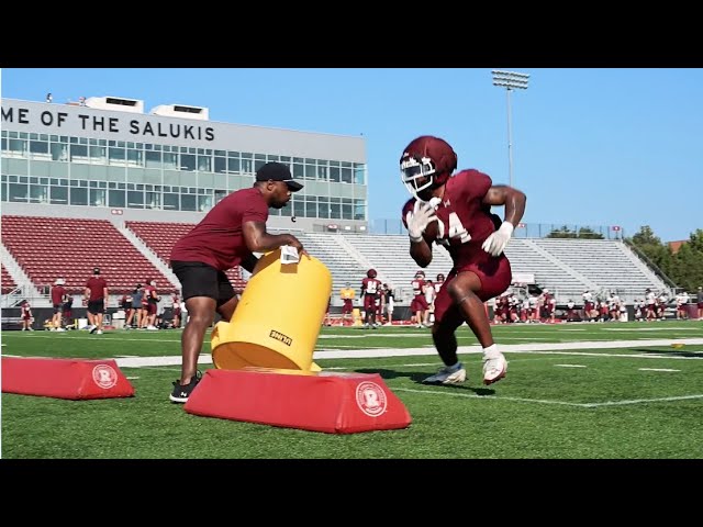 Coach Larry Warner helps running backs perfect their craft
