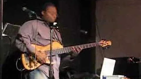 Terrance Palmer playing bass at Xhedo's Cafe