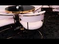 Pink Restautrant Chairs with Gold Frame and Black Table Tops with Gold Base.